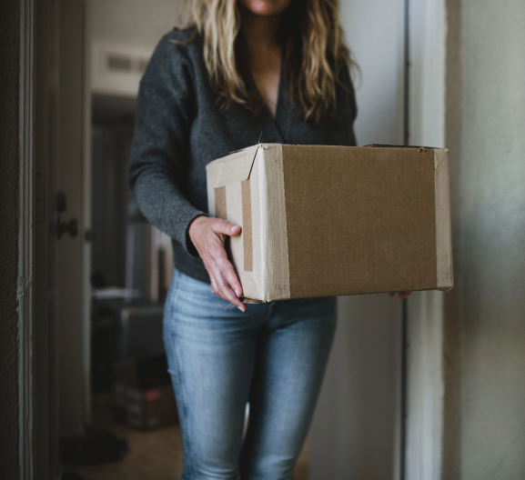 woman getting her package from front door