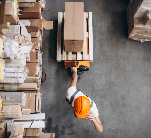 young man working in warehouse with boxes