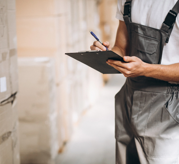 young man working warehouse with boxes